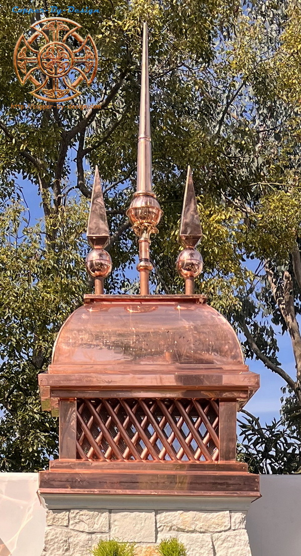 A custom copper chimney cap with 3 finials