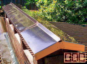 A copper roof cover for a long chimney for Tullier in N. W. Portland, Oregon